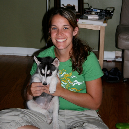 woman with husky puppy