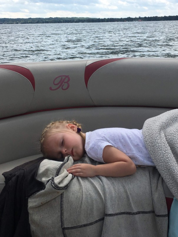 girl sleeping on a boat